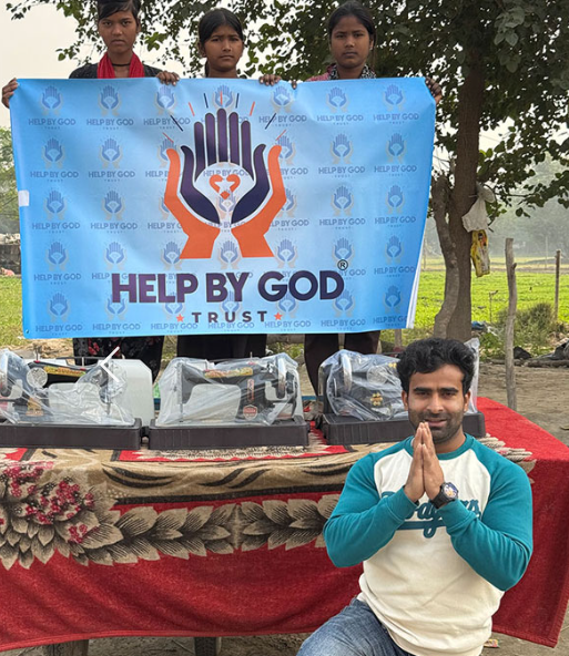 Sewing machines ready for distribution with Help By God Trust banner